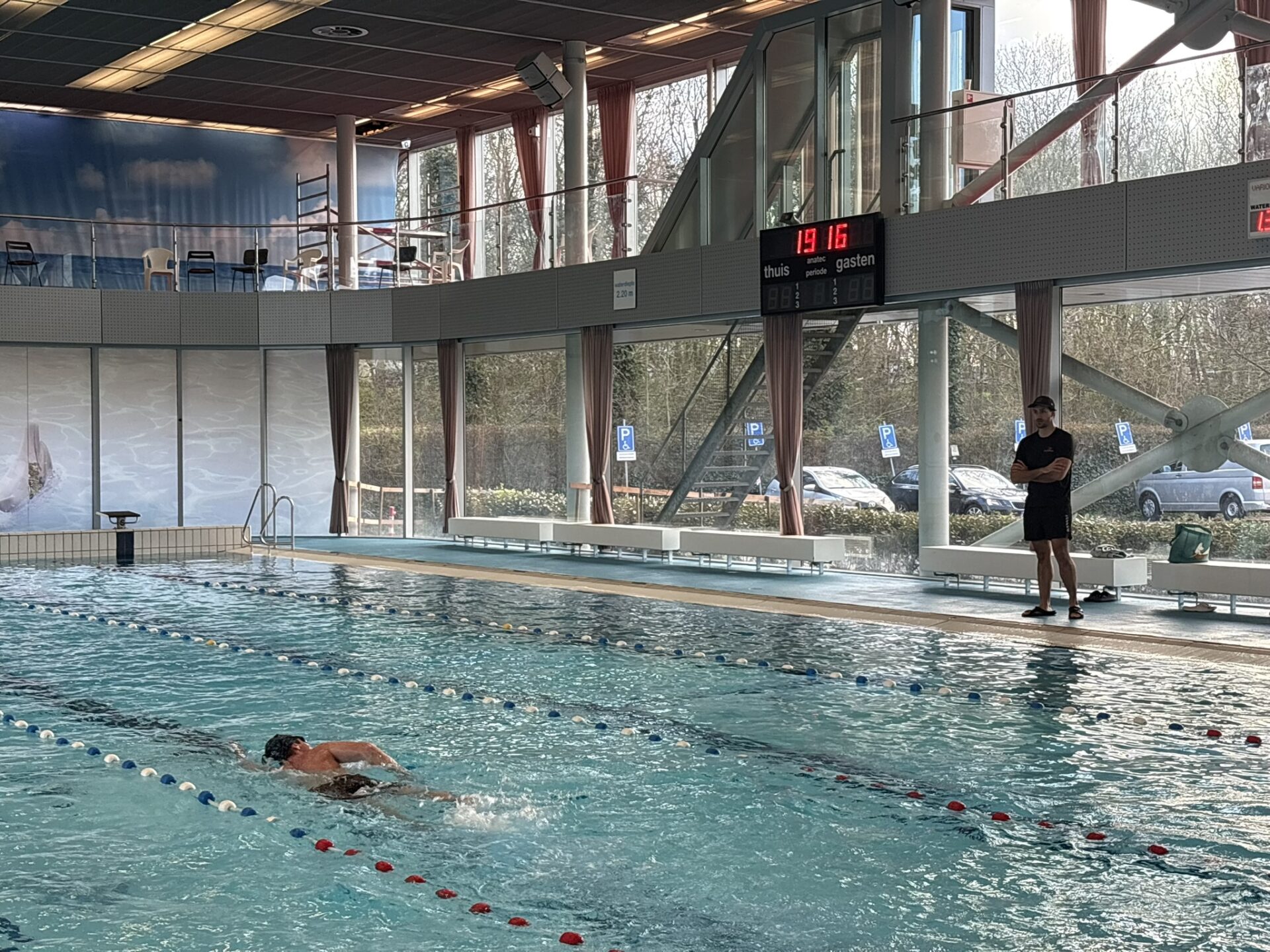 Intermediate swimmers building endurance with continuous laps in Amsterdam pool