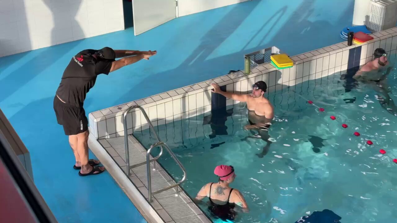 Swimmer practicing underwater gliding and push-offs